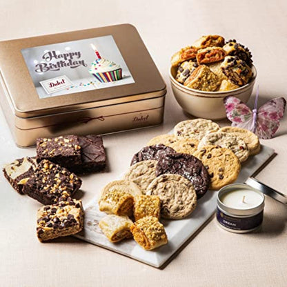 Gift tin with assorted cookies and brownies plus a small candle