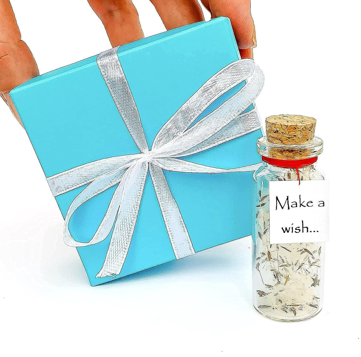 Turquoise gift box with white ribbon bow and miniature wish bottle jar
