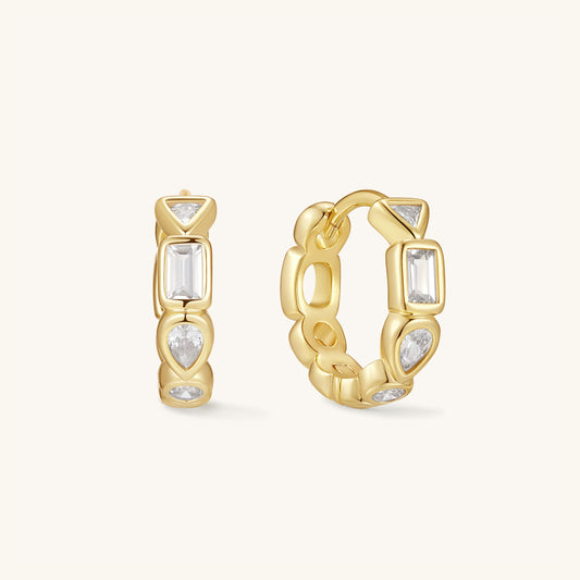 Gold-tone gemstone hoop earrings with rectangular clear stones and round crystal accents
