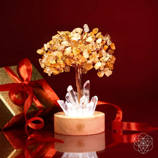 Crystal tree lamp with golden citrine branches and clear quartz clusters on wooden base