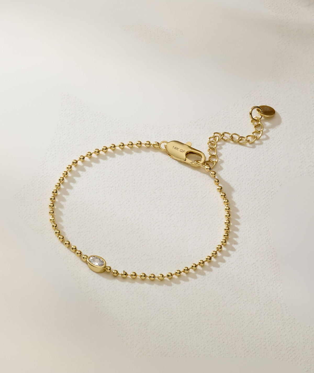 Gold-filled beaded bracelet with oval diamond charm and 14K GF clasp