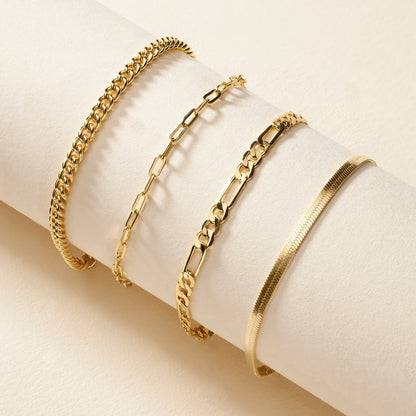 Gold-tone herringbone chain bracelet with clasp displayed with matching bangles