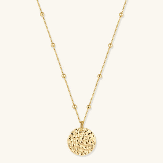Gold coin pendant necklace with hammered round disc; adjustable thin chain