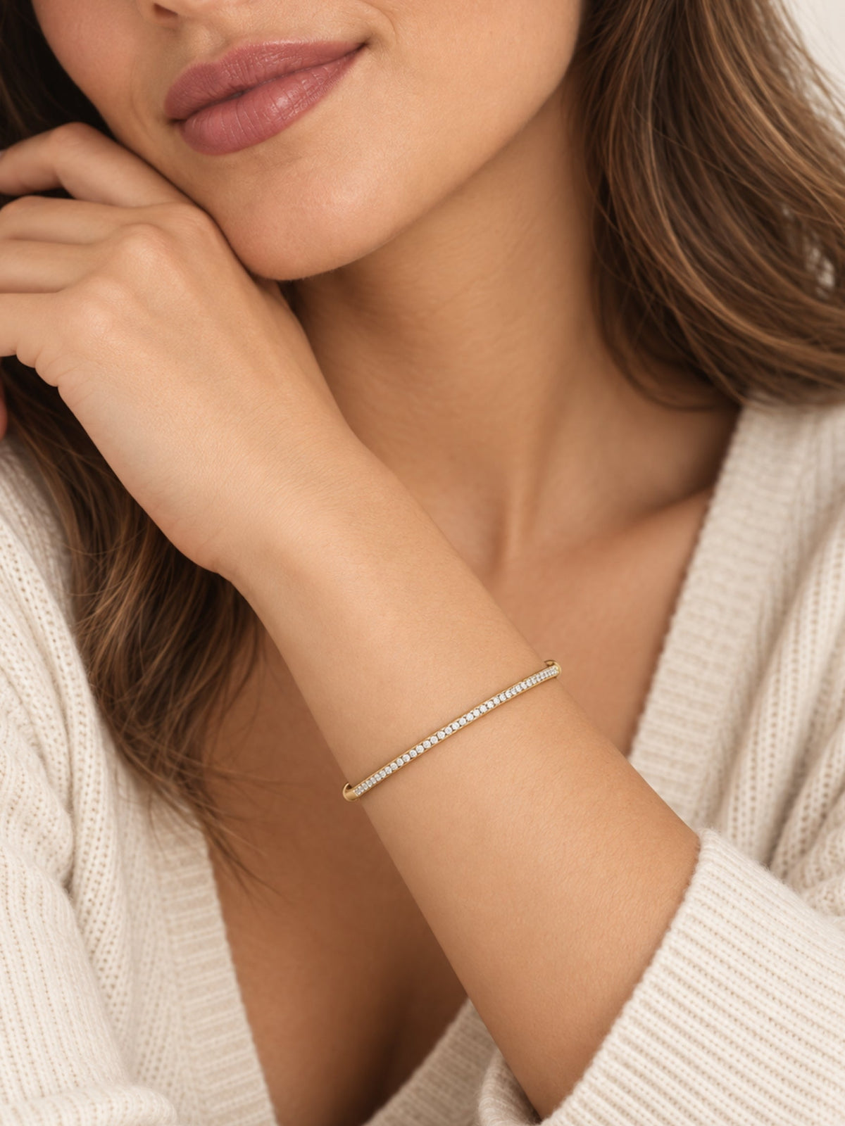Thin gold filled pave cuff bracelet on a model's wrist
