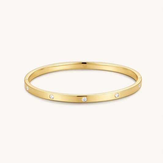 Gold-filled diamond bangle with three round stones on slim gold cuff