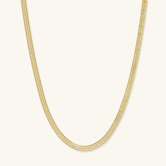 Gold herringbone chain necklace, close-up of smooth link pattern