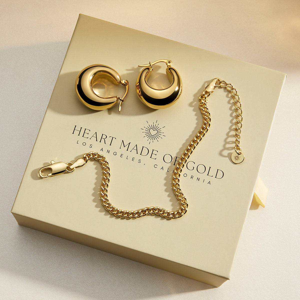 Gold curb chain bracelet displayed on jewelry card