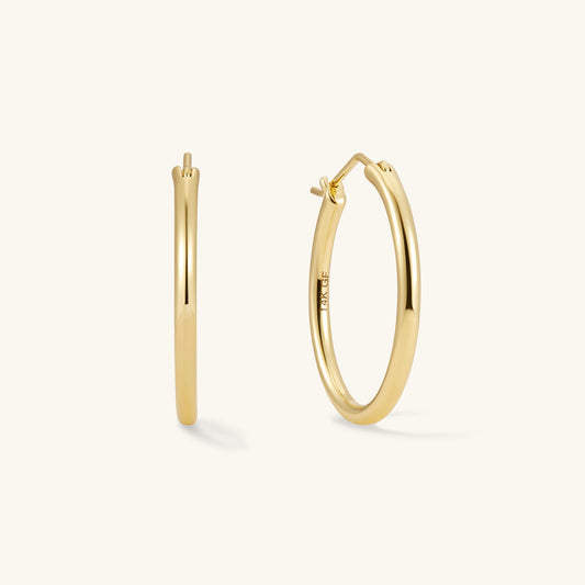 Gold filled medium hoop earrings with hinged post detail
