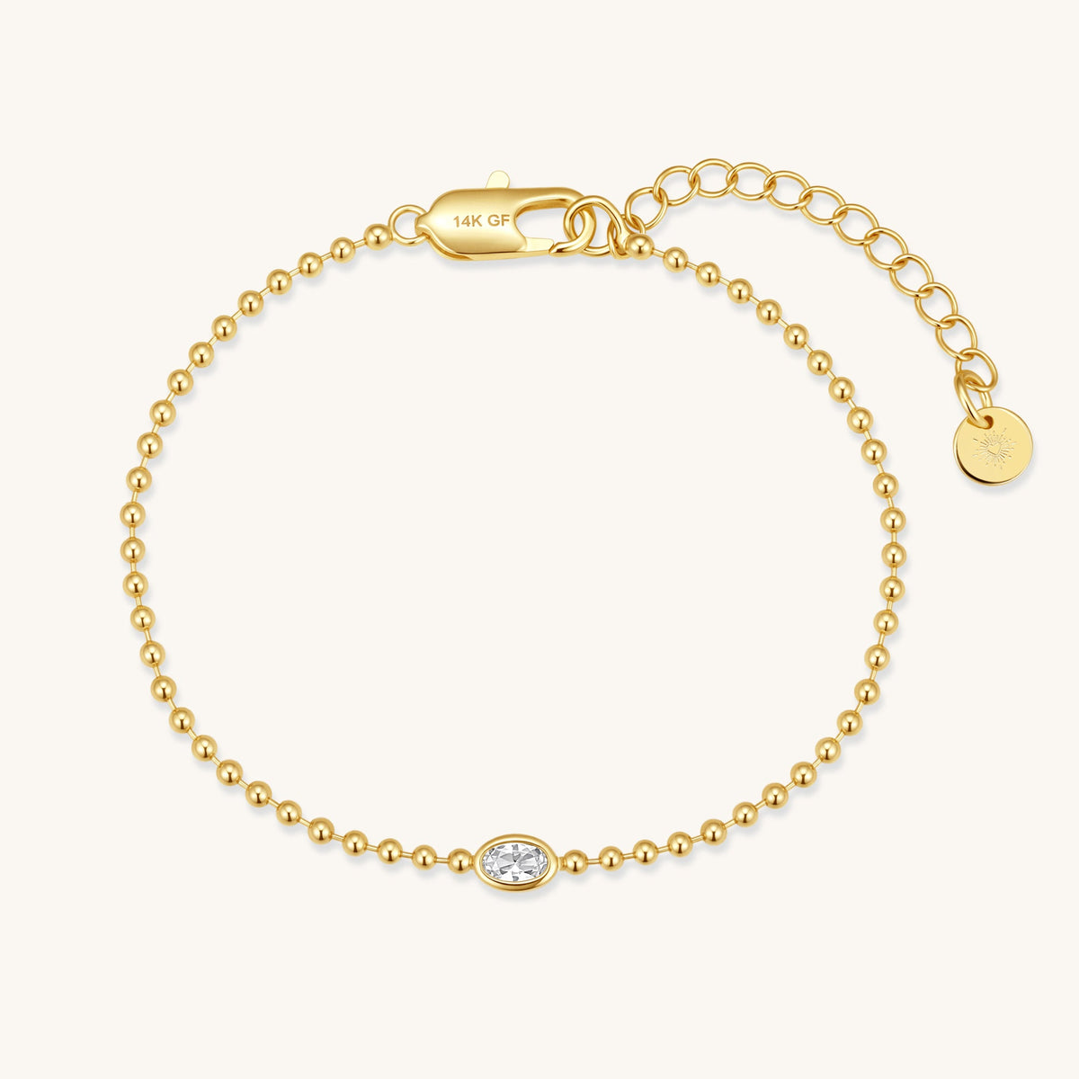 Gold-filled beaded bracelet with 14K GF clasp and oval diamond center charm