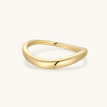 Gold wavy dome ring with a smooth raised top and polished finish
