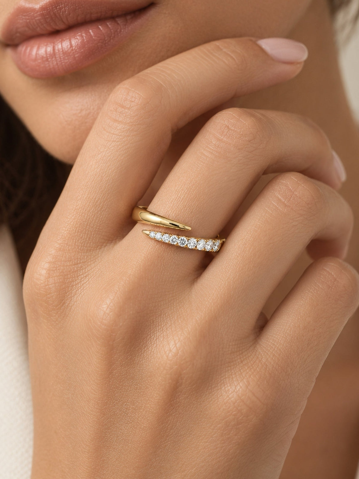 Gold spiral ring with a slim pave strip of white stones across the band
