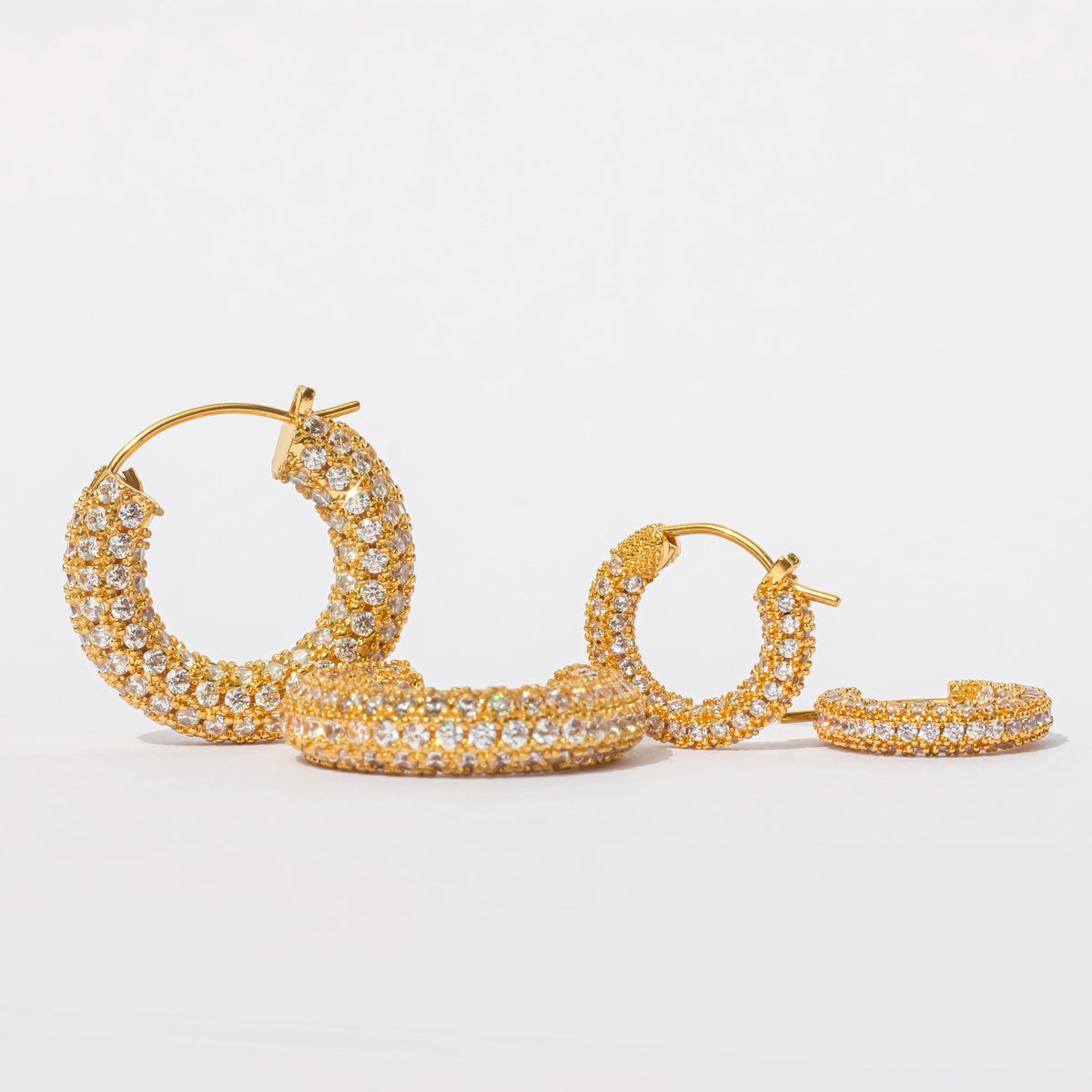 Small gold pavé hoop earrings with hinged closure