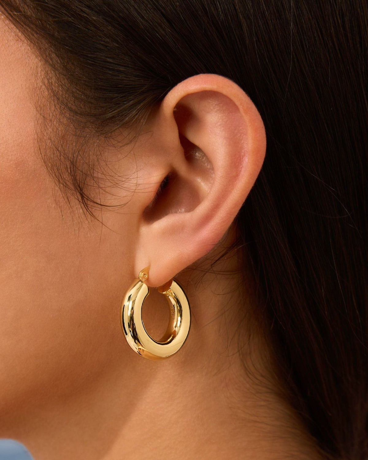 Gold chunky hoop earrings, medium-large size on ear