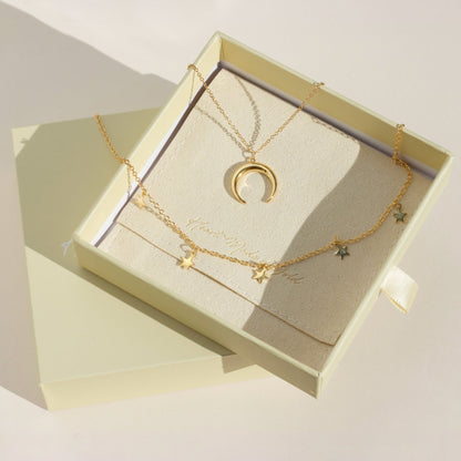 Gold star choker and crescent moon necklace set with layered star charms