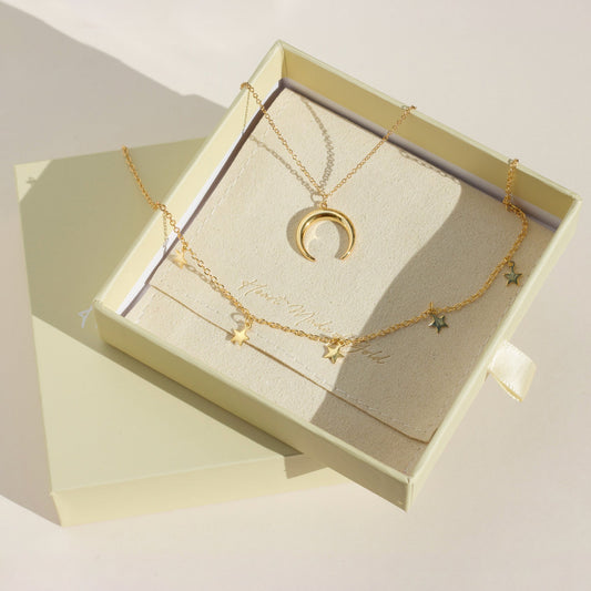 Gold star choker and crescent moon necklace set with layered star charms