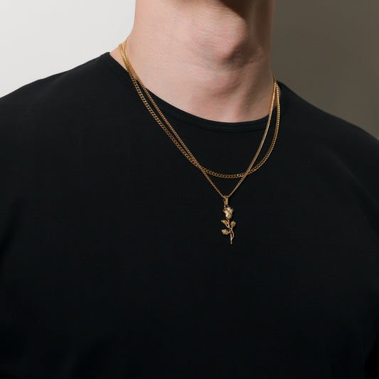 Gold-toned layered necklace set with rose pendant and leaf details
