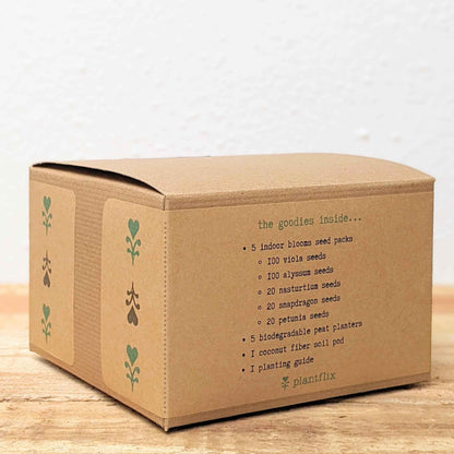 Kraft seed kit box side panel with printed contents list and Plantfix logo