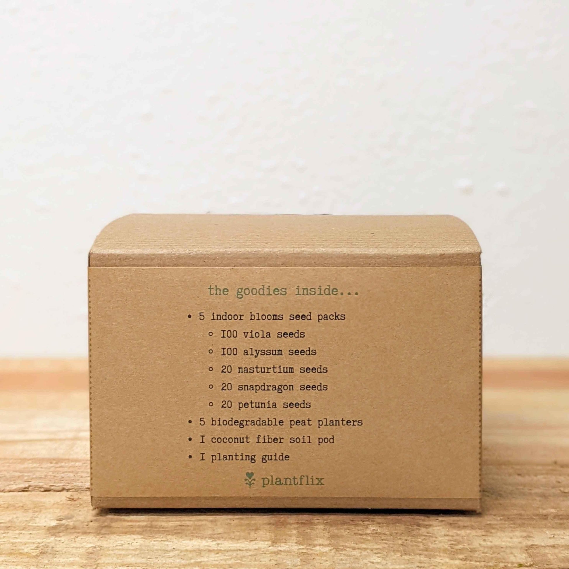 Kraft seed kit box back panel with printed contents list and Plantfix logo
