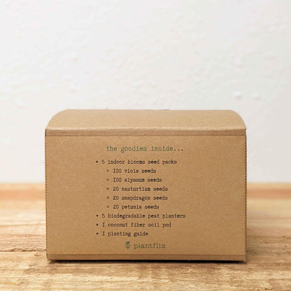 Kraft seed kit box back panel with printed contents list and Plantfix logo
