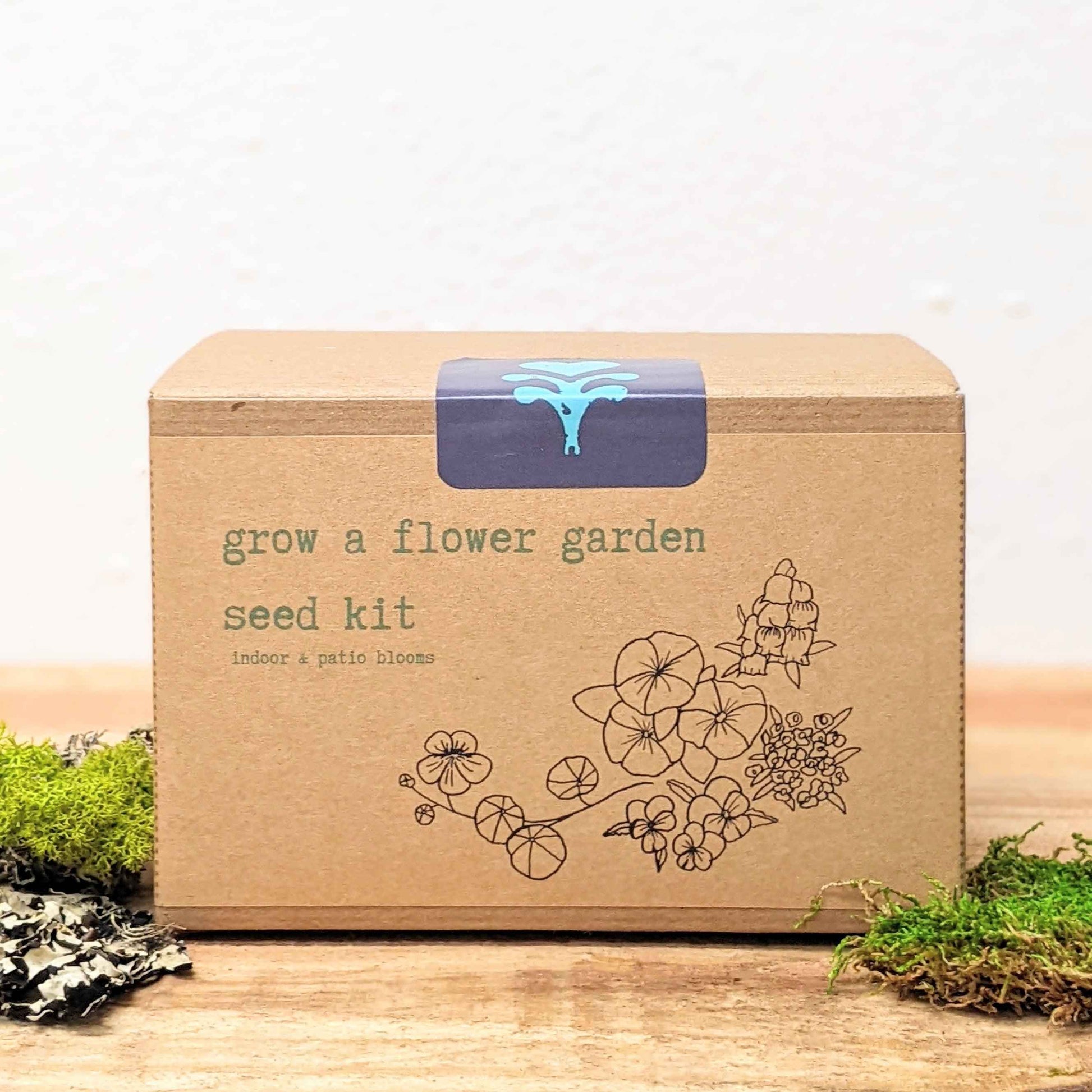 Kraft flower seed kit box front with blue top label and line-drawn flower illustration