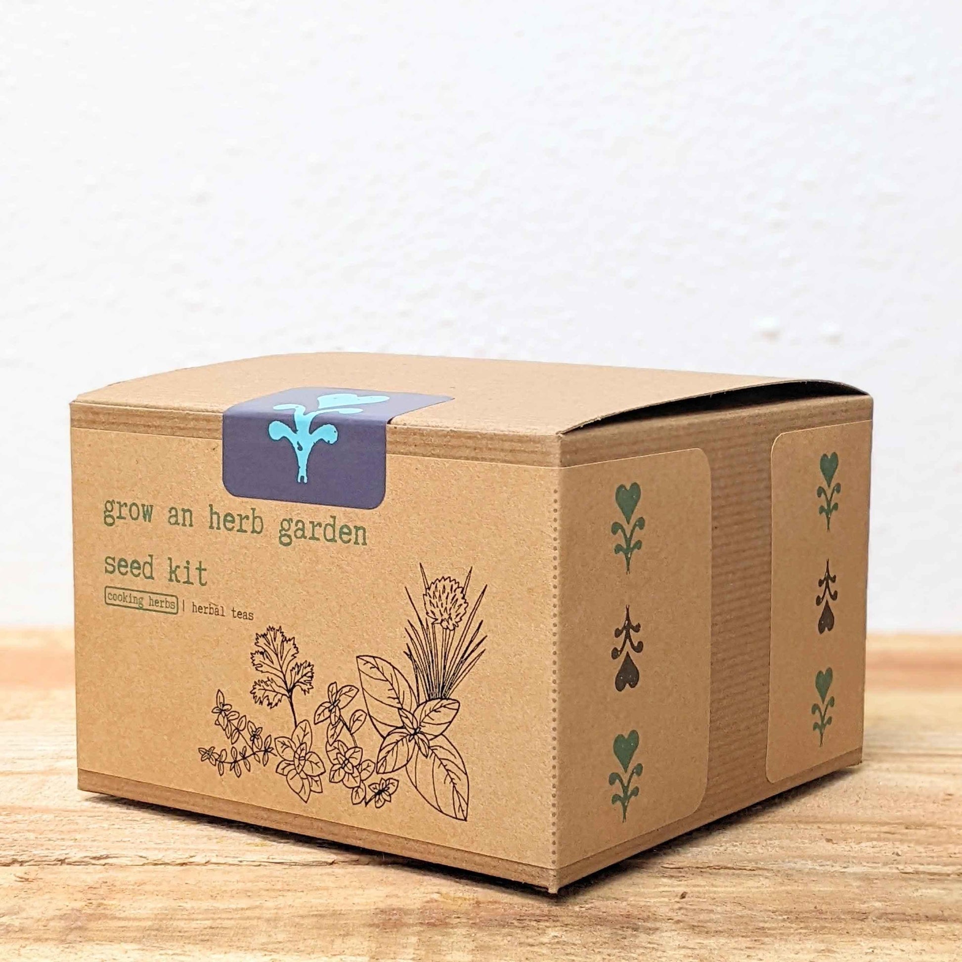 Herb seed kit box angled view with 'grow an herb garden' label and herb icons