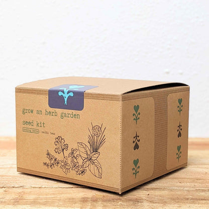 Herb seed kit box angled view with 'grow an herb garden' label and herb icons