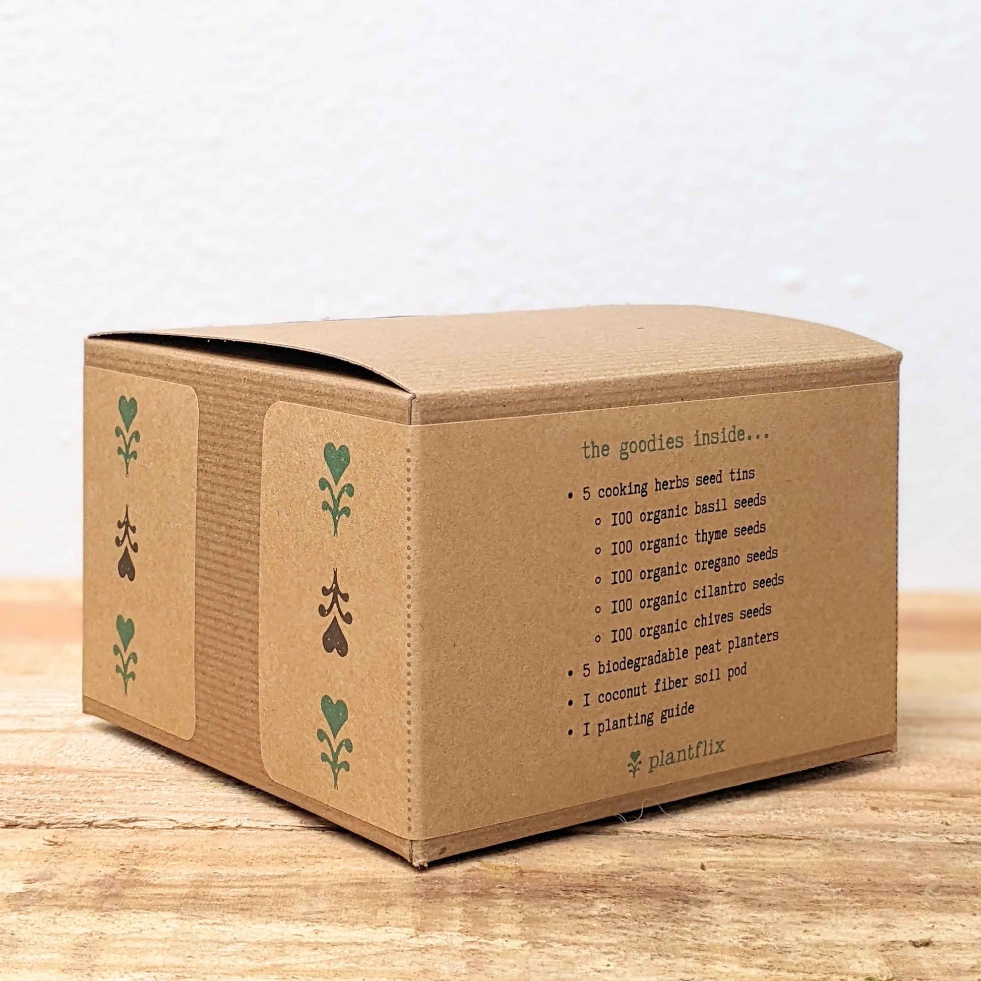 Herb seed kit box side panel with contents list of organic herb seeds and plant pod