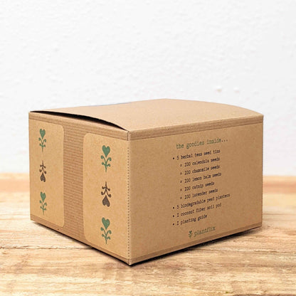 Seed kit box back panel with list of herbal tea seed tins and seeds