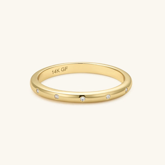 Gold-filled diamond band ring with three small white stones, polished gold finish