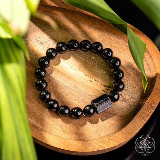 Black bead bracelet with faceted rectangular stone charm at center