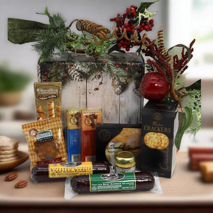 Deluxe holiday gift box with gourmet snack packages and crackers, styled on table