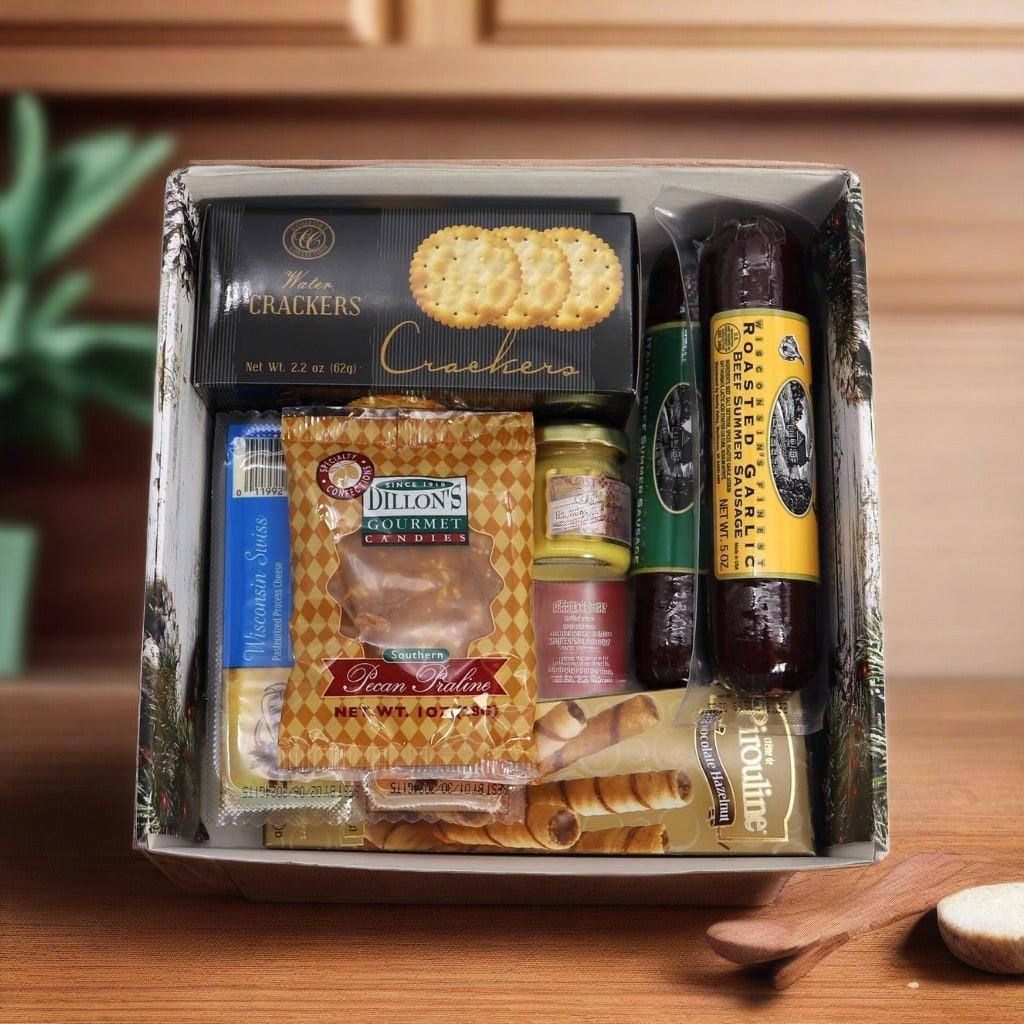 Open deluxe holiday gift box with crackers, candies, and jars of spreads inside