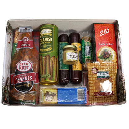 Open holiday gift box with assorted gourmet foods, organized compartments
