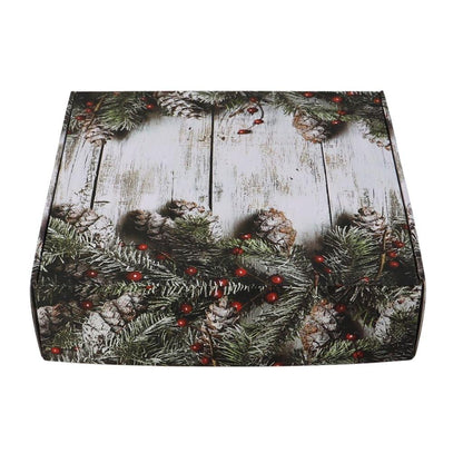 Decorative holiday gift box with pine branches, pinecones and red berry pattern