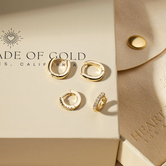 Gold huggie hoop set with four small hoops, smooth and pavé styles