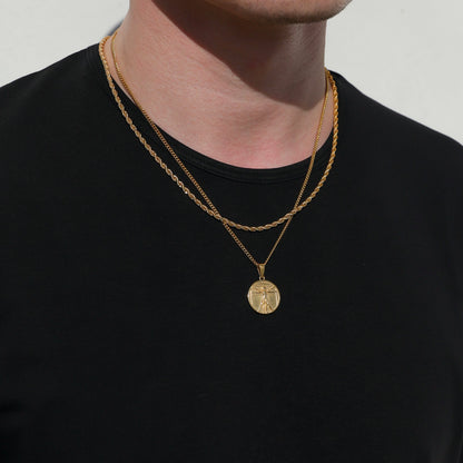 Gold-tone pendant necklace with two chains and circular medallion charm