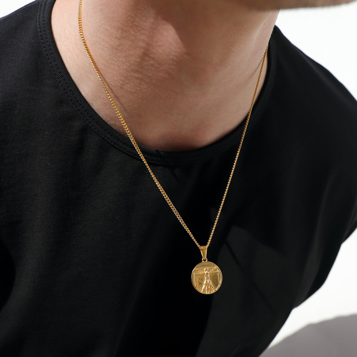 Gold rope chain necklace with round Vitruvian Man medallion pendant