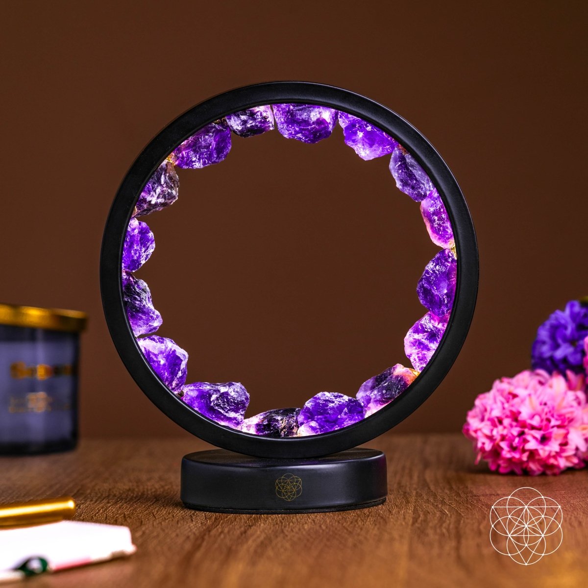 Amethyst halo lamp with purple crystal ring and black circular base