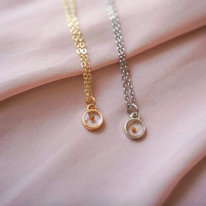 Gold and silver mustard seed necklaces with small round pendants