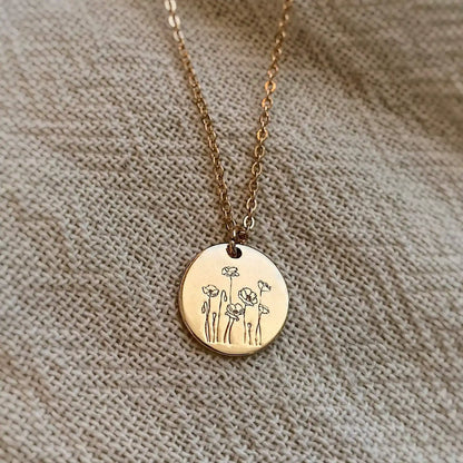 Gold-tone Poppy Necklace with round flower-engraved pendant and fine chain