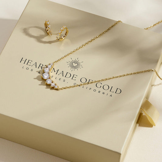Gold diamond cluster necklace with hoop studs, gold-tone chain and sparkling stones