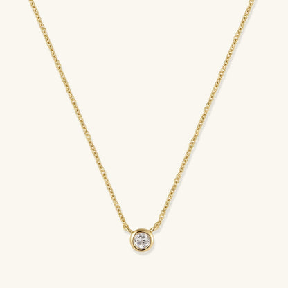 Gold-tone chain necklace with round bezel-set diamond pendant
