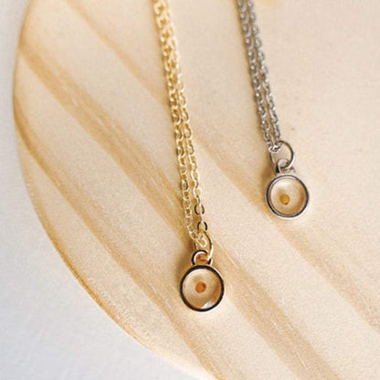 Mustard seed faith necklace set with gold and silver chains and round seed pendants