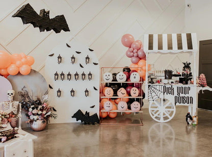 Bat piñata wall decoration, dark gray with layered edges and small eye dots