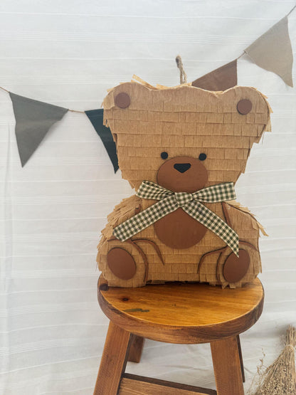 Small teddy bear piñata, tan paper layers, brown face, green plaid bow