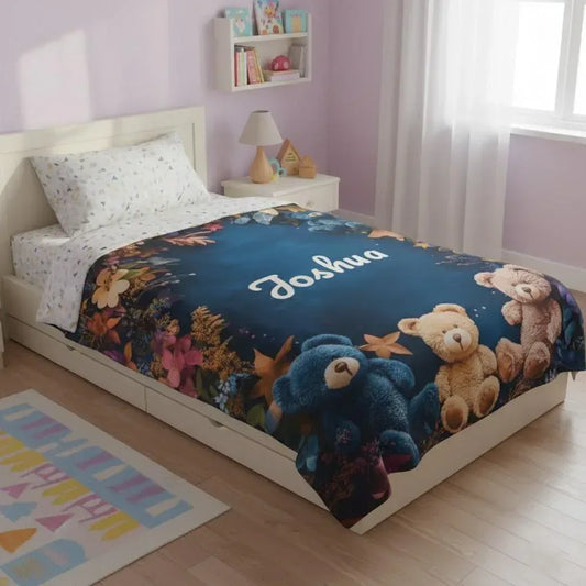 Personalized teddy bear blanket on bed with blue center and name Joshua
