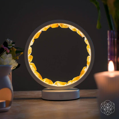 Citrine manifestation lamp on a base with bright amber ring light