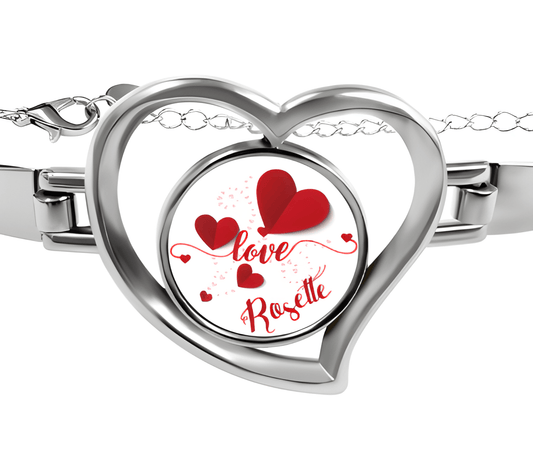 Heart charm bracelet with silver heart locket reading "Love Rosette" and red hearts