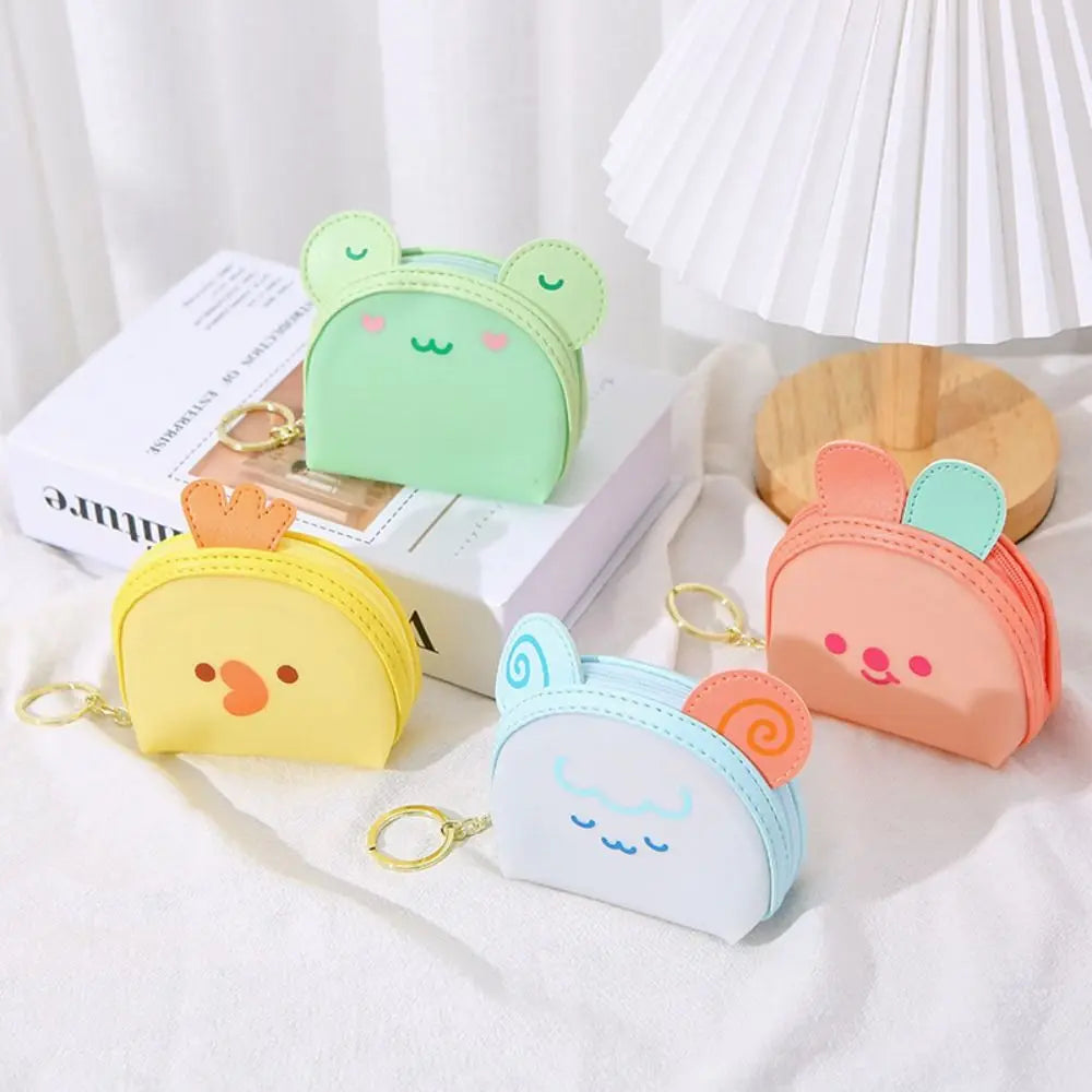 Kawaii animal coin purse set with yellow, mint, and pink faces plus key rings