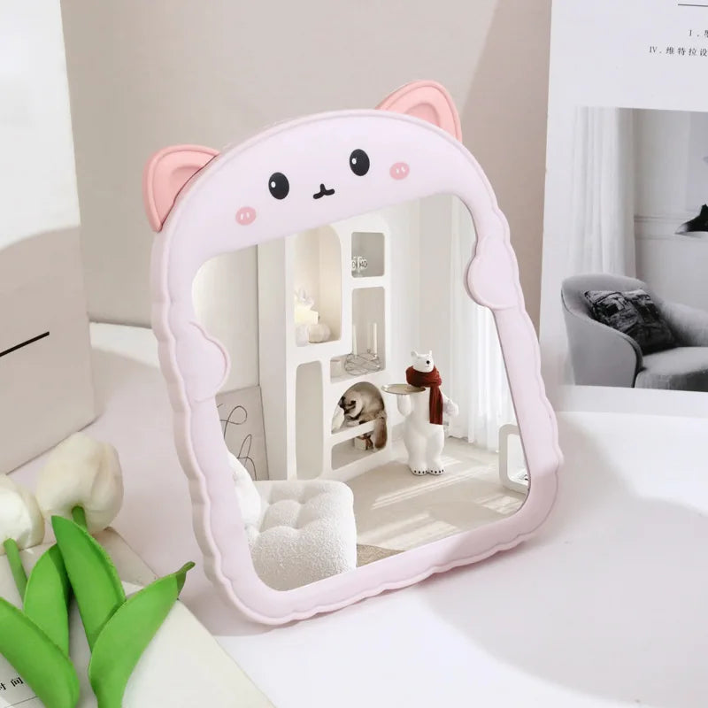 White and pink animal-shaped desktop mirror with bear-like ears and face graphics